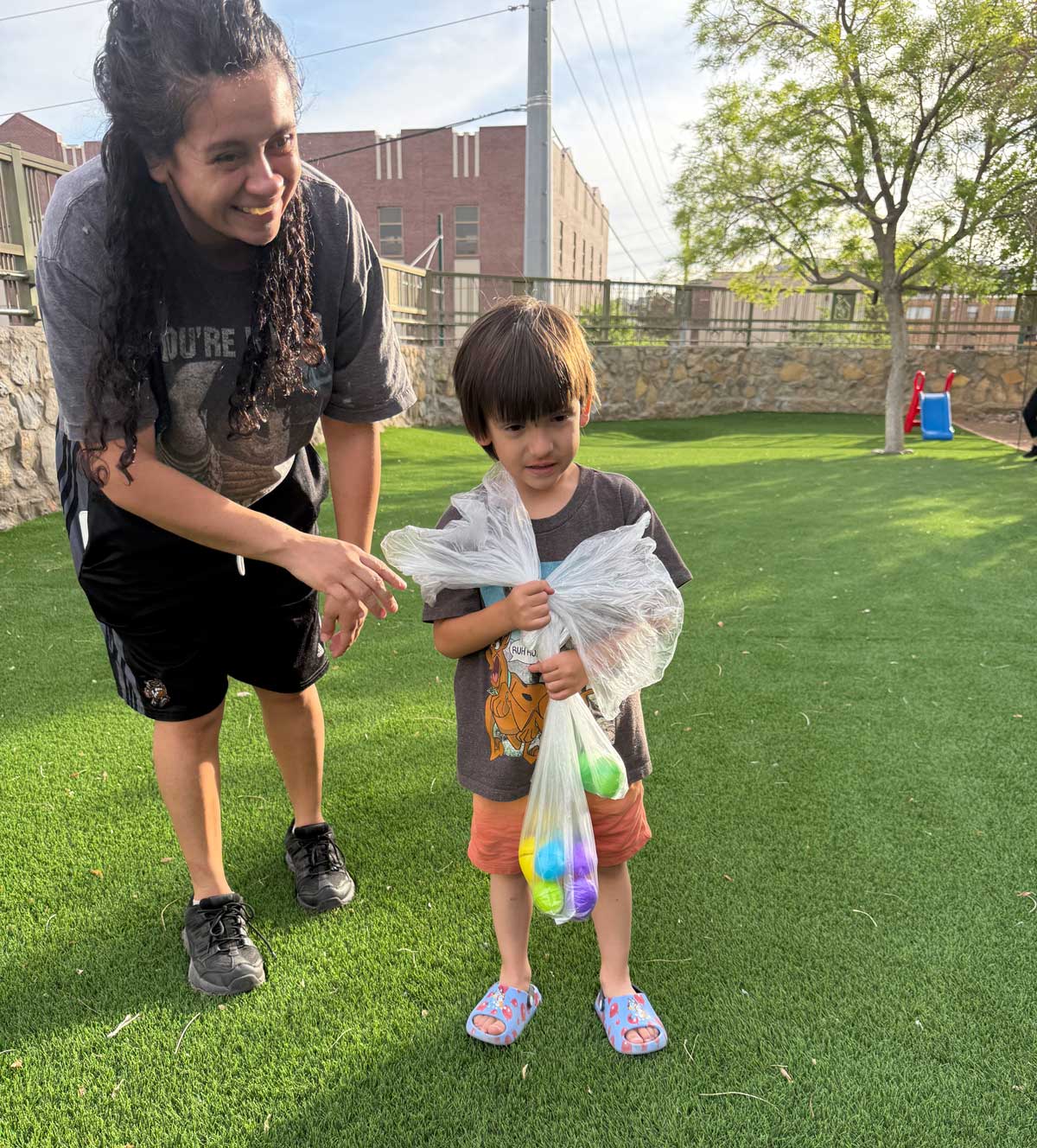A boy and woman during an easter egg hunt