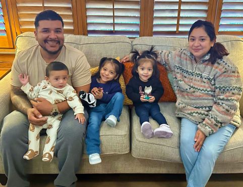 The Arzaga Family Sitting on Couch